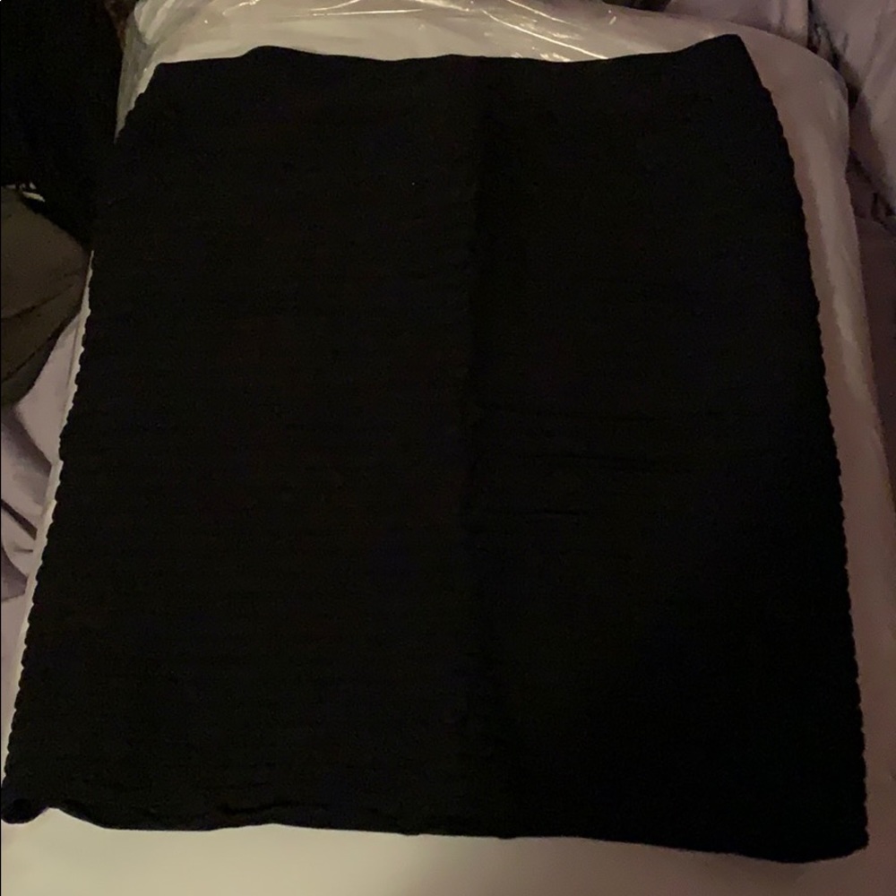 Bebe black stretchy skirt with ruffle like design